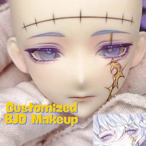 May include: A close-up of a doll's face with detailed makeup. The doll has pale skin, purple and silver eye makeup, and a gold design on the cheek. The text "Customized BJD Makeup" is visible.