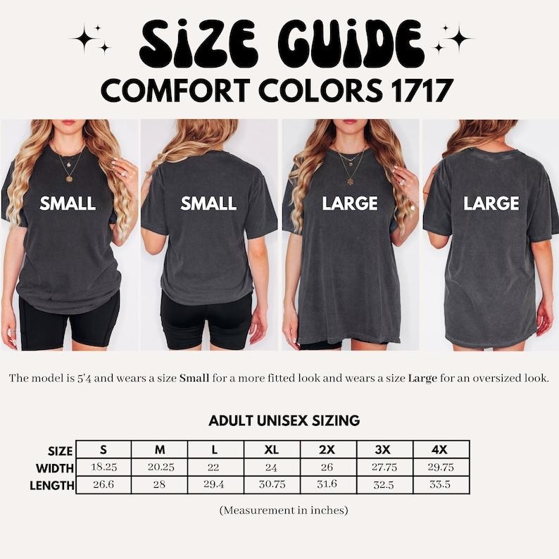 May include: Size guide for Comfort Colors 1717 t-shirts. The image shows models wearing small and large shirts. The size chart provides measurements in inches for adult unisex sizes, including width and length.
