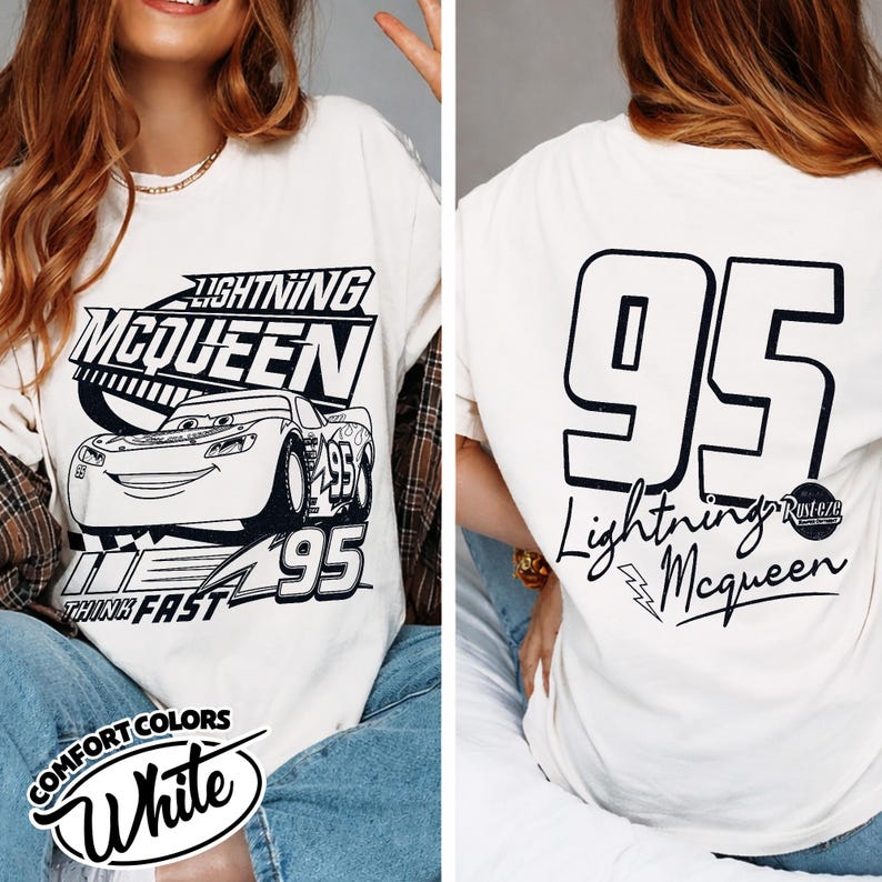May include: Cream-coloured t-shirt with Lightning McQueen graphics. The front shows the character, the text "Lightning McQueen," and the number "95." The back has a large "95" and "Lightning McQueen" in script. A fun, casual tee.