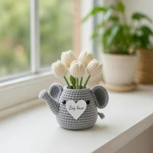 May include: A set of three ceramic mugs with a speckled, matte finish. The mugs are in shades of cream, light gray, and dark gray. Each mug has a simple, minimalist design, perfect for coffee or tea.