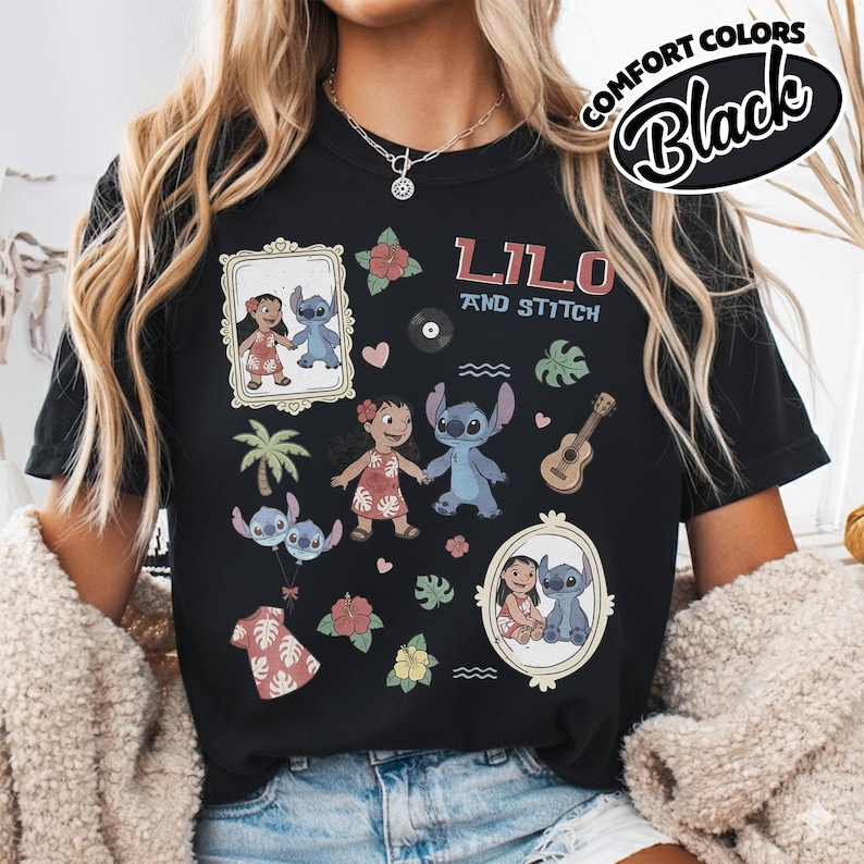 Puede incluir: Camiseta negra con un dise&ntilde;o gr&aacute;fico colorido con "Lilo y Stitch". El dise&ntilde;o incluye ilustraciones de Lilo y Stitch, junto con elementos tropicales. La camiseta est&aacute; etiquetada como "Comfort Colors Black."