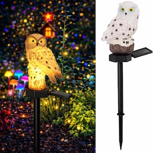 May include: Two solar-powered garden owl lights. One owl is tan with yellow eyes, the other is white with black spots. Both are perched on a black stake with a solar panel. The background is a garden with colorful lights.