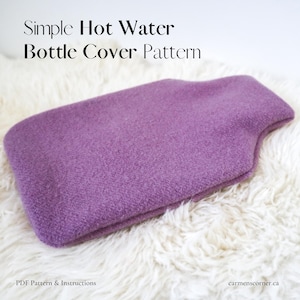 May include: A lavender hot water bottle cover made of a soft, textured fabric. The cover is rectangular with a curved top and is displayed on a white, fluffy surface. Text on the image reads "Simple Hot Water Bottle Cover Pattern."