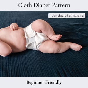 May include: A baby wearing a white cloth nappy lies on a dark blue textured surface. The text "Cloth Diaper Pattern" and "+ with detailed instructions" are at the top. The text "Beginner Friendly" is at the bottom.