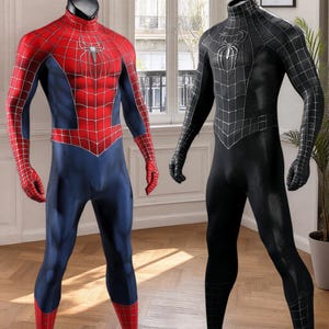 May include: Two full-body spandex suits displayed on mannequins. One suit is red and blue with a silver spider emblem and web pattern. The second suit is solid black with a silver spider emblem and a subtle black web pattern across the entire fabric.
