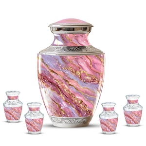 May include: A large decorative urn and several smaller keepsake urns. The urns feature a swirling design in shades of pink, purple, and gold. The large urn has a silver lid and base. The smaller urns have a similar design.