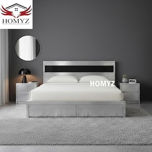 May include: A modern bed frame with a riveted metal design, featuring a black accent on the headboard. The bed is paired with matching nightstands and a soft, white comforter. The image includes the text "HOMYZ".