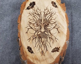 Laser engraved Green Man log slice