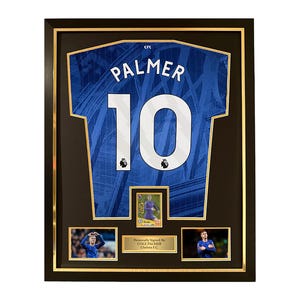 May include: Framed blue football shirt with the name "PALMER" and the number "10" in white. The frame includes three smaller images and a gold border, with the text "Personally Signed By Cole Palmer Chelsea FC".