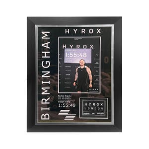 May include: Framed HYROX event photo in a black frame. The photo displays the text "BIRMINGHAM" vertically on the left and "HYROX" at the top. The image includes a person and the text "FINISH TIME 1:55:48".