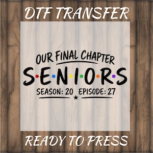 May include: A DTF transfer sheet featuring the black text 'OUR FINAL CHAPTER', 'SENIORS' with colorful dots between the letters, and 'SEASON: 20 EPISODE: 27' with a small star. The design is ready to press for application onto fabric surfaces.