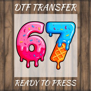May include: DTF transfer design featuring the numbers 67, styled as colorful desserts. The number 6 is pink with sprinkles and dripping icing. The number 7 is blue with sprinkles and an orange waffle cone base. The text "READY TO PRESS" is at the bottom.