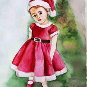 May include: Watercolor painting of a child in a red Santa Claus outfit. The dress has white trim and a black belt. The child wears a Santa hat and red shoes. A Christmas tree is in the background. The artist's signature is in the bottom right corner.