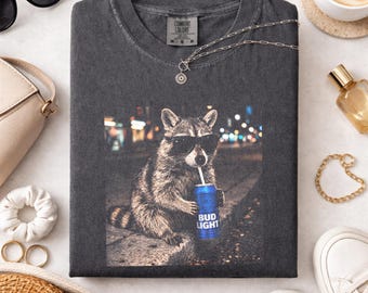 Comfort Colors Raccoon Blue Bud Light Drink Graphic Tee, Fun Animal Lover Shirt, Vintage Raccoons Shirt, Funny Meme Genz Beer Raccoons Shirt