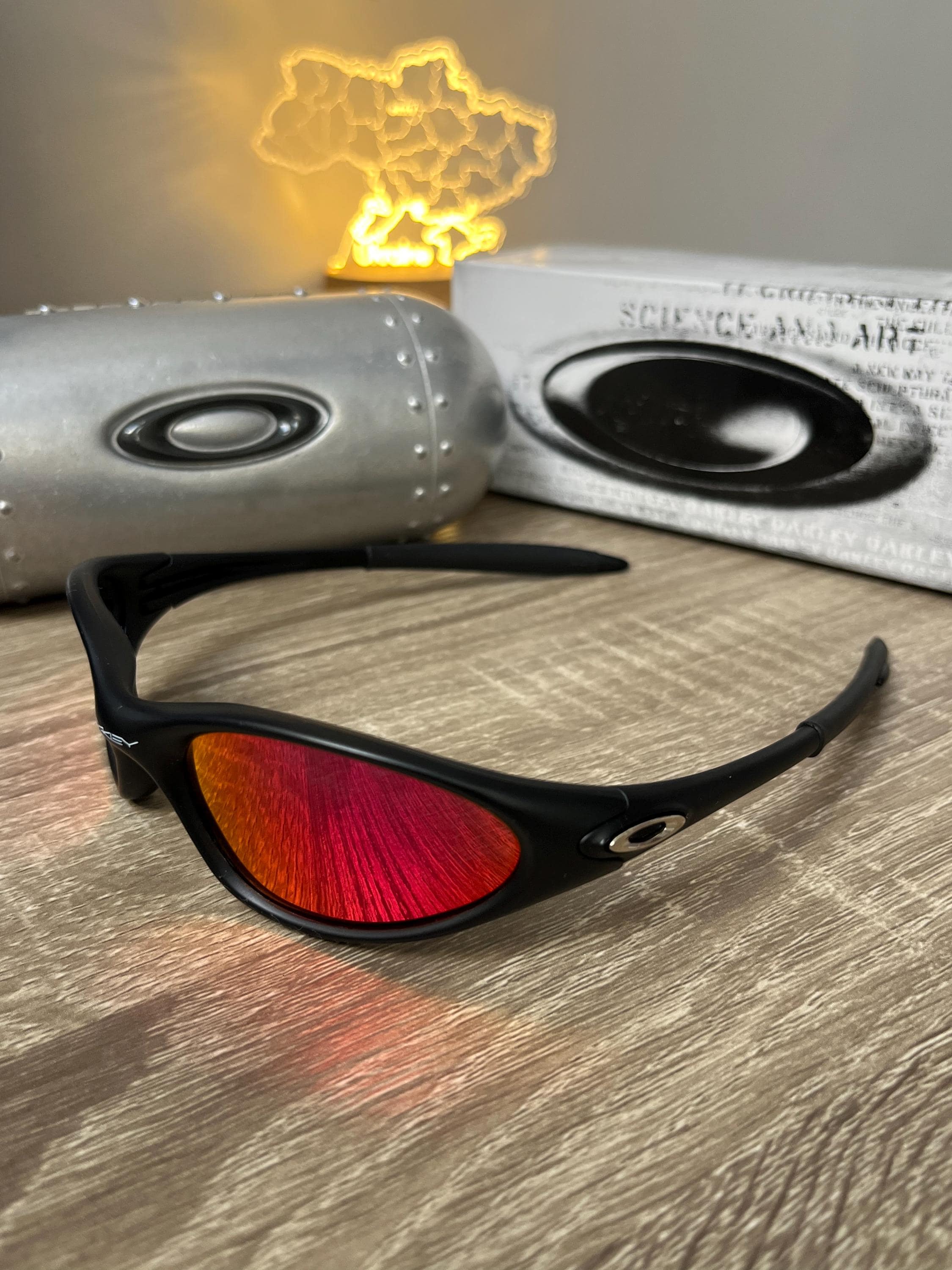 Oakley Minute 1.0:matte Black Y2K Wrap Sunglasses With Red Lenses