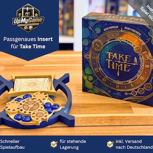 Puede incluir: Un organizador de juegos azul y dorado para el juego de mesa "Take Time" con el texto "Passgenaues Insert für Take Time". El organizador contiene cartas, fichas y piezas de juego. La caja del juego es visible en el fondo.