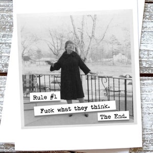 May include: Black and white photo of a woman standing on a porch with a railing. The photo is a vintage style print with text that reads "Rule #1 Fuck what they think. The End."