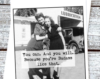 May include: A black and white greeting card featuring a vintage photograph of two people standing in front of a service station with the text: You can. And you will. Because you're Badass like that. The card has a white border and a square frame.