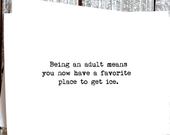 May include: A white greeting card with the text: "Being an adult means you now have a favorite place to get ice." The card is on a distressed, white wooden surface.