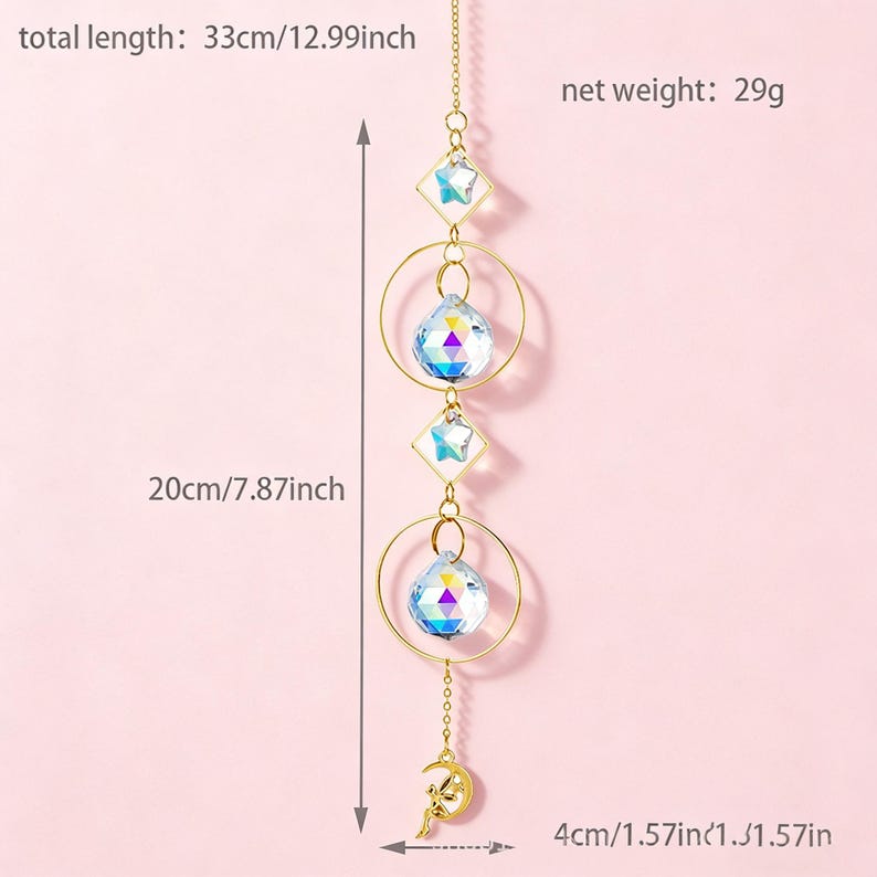 May include: A decorative suncatcher with a total length of 12.99 inches. It features a gold chain with clear crystal beads, gold rings, and a crescent moon charm. The net weight is 29 grams.