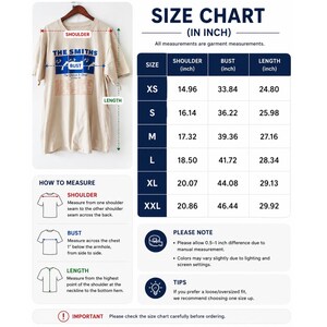 May include: Beige t-shirt with "THE SMITHS" graphic and size chart. The chart shows shoulder, bust, and length measurements in inches for sizes XS to XXL. Includes instructions on how to measure and important notes.