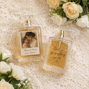 May include: Two rectangular glass perfume bottles filled with amber liquid. One bottle features a photo of a woman and child with the text "Today and always. Love, Aurora." The other bottle has the text "Thank you for everything you do" with a heart symbol.