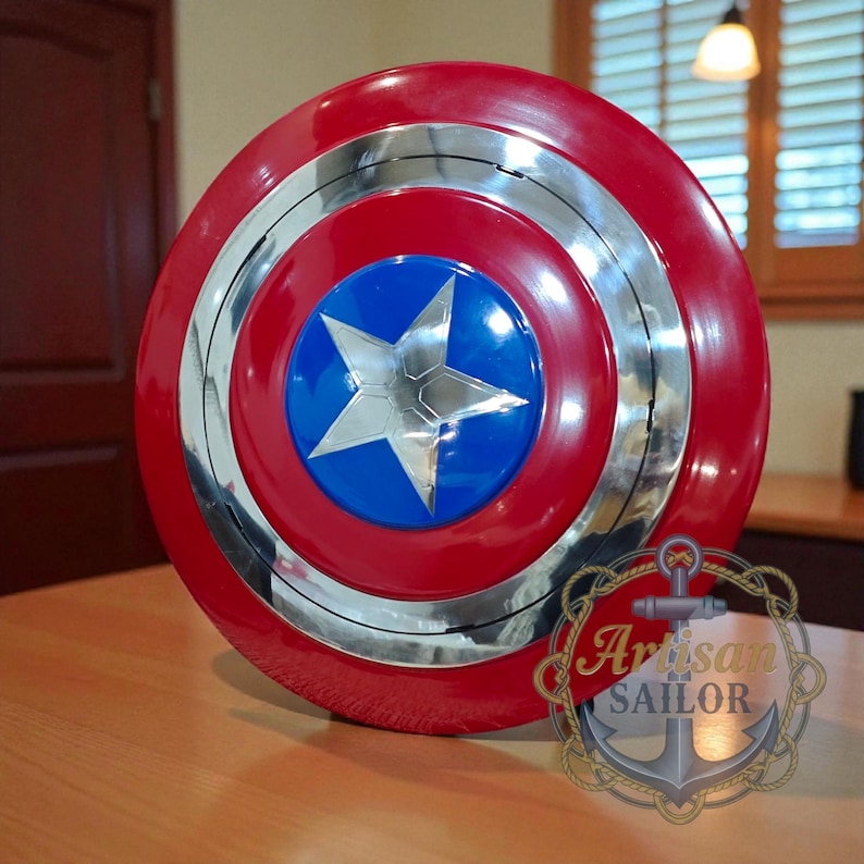 Captain America shield replica, metal wall decor with red/white/blue and star; engraved outer ring, personalized cosplay gift.