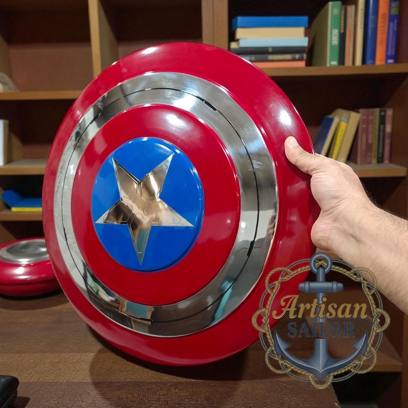 Captain America shield replica, metal wall decor with red/white/blue and star; engraved outer ring, personalized cosplay gift.