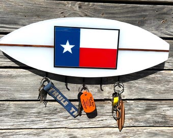 Texas Surf key holder ya it happens in Texas we got Wing Surfers Wake Surfer Kite Surfers Foilers Surf Ranch.  Texans love Surfing