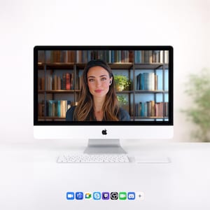 May include: A silver Apple iMac computer with a white keyboard and trackpad. The screen displays a video call featuring a person with long brown hair in front of a bookshelf. Below the screen are icons for various communication applications.