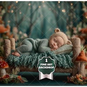 May include: A sleeping baby wearing a knit bear hat and a green outfit, resting on a miniature wooden bed with a teal blanket. The scene is set in a whimsical forest with mushrooms and soft lighting. The image includes the text "1 Fine Art Backdrop".