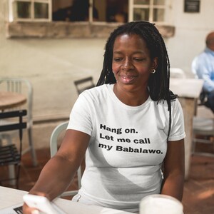 Hang on... Let me call my Babalawo  - White T-Shirt - Unisex - Yoruba, Santeria, Orisha Clothing, Lukumi, Lucumi, Isese