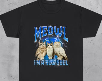 May include: Black t-shirt featuring a graphic of three cat-owl hybrids with the word "MEOWL" in blue lightning font above them. The text "I'M A NEW SOUL" is below the cat-owls. The word "BLACK" is at the top left.