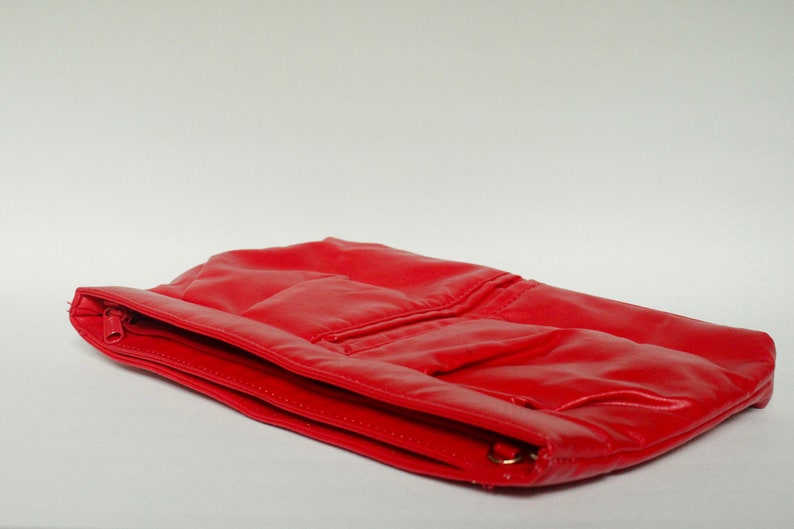 bright red clutch bag