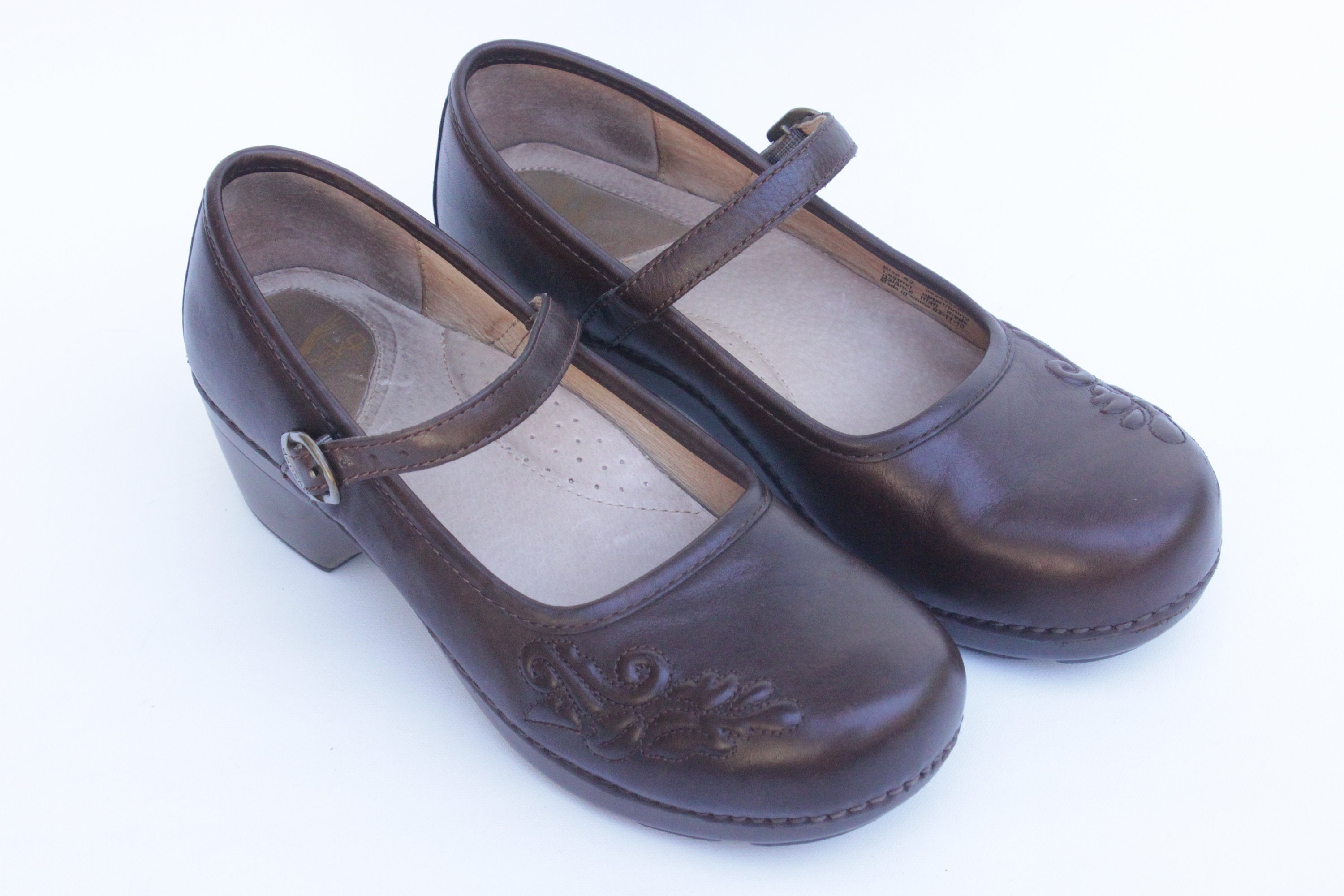 dansko brown leather clogs