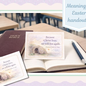 May include: An open notebook, a pen, and a closed burgundy Bible rest on a wooden desk. Two cards with the text "Because Christ lives, we will live again" are visible. The image is framed with a light green border and text that reads "Meaningful Easter handouts!"
