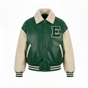 May include: Green and cream varsity jacket with a white "E" patch. The jacket features a cream-colored collar and sleeves, with green body and a striped hem and cuffs. The jacket has a button-up front.