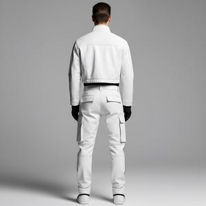 May include: A white jacket and cargo pants set. The jacket is cropped with a high collar and black trim. The pants have multiple pockets and a slim fit. The outfit is completed with black gloves and white sneakers. The model is facing away from the camera.