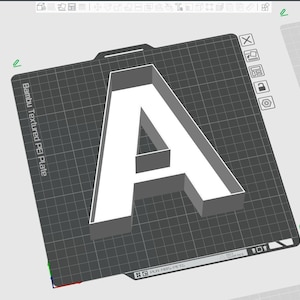 May include: A 3D-rendered white letter "A" on a dark grey textured surface. The letter has a box-like structure. The surface has a grid pattern and text that reads "Bambu Textured PEI Plate".