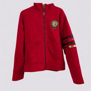 May include: A set of three ceramic mugs with a speckled, matte finish. The mugs are in shades of cream, light gray, and dark gray. Each mug has a simple, minimalist design, perfect for coffee or tea.