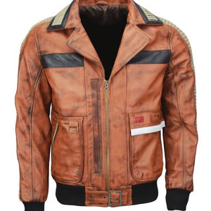 May include: A brown leather jacket with a distressed finish. The jacket features a black collar, black stripes across the chest, and a black ribbed hem and cuffs. It has a zipper closure and multiple pockets, with a small red and white accent on the right side.