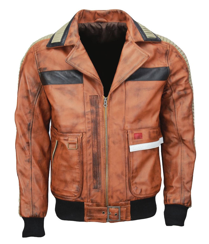 May include: A brown leather jacket with a distressed finish. The jacket features a black collar, black stripes across the chest, and a black ribbed hem and cuffs. It has a zipper closure and multiple pockets, with a small red and white accent on the right side.