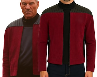 May include: A burgundy jacket with black accents and a black zipper. The jacket has a high collar and a gray shoulder panel. The image shows the jacket on a person and a model.