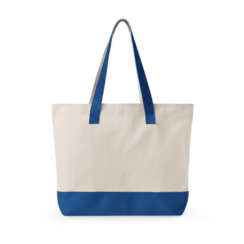 A canvas tote bag with a cream-colored body and a vibrant blue base. The bag features matching blue handles. This versatile tote is suitable for carrying groceries, books, or personal items. The bag is made of durable material. This picture is of the back of the bag.