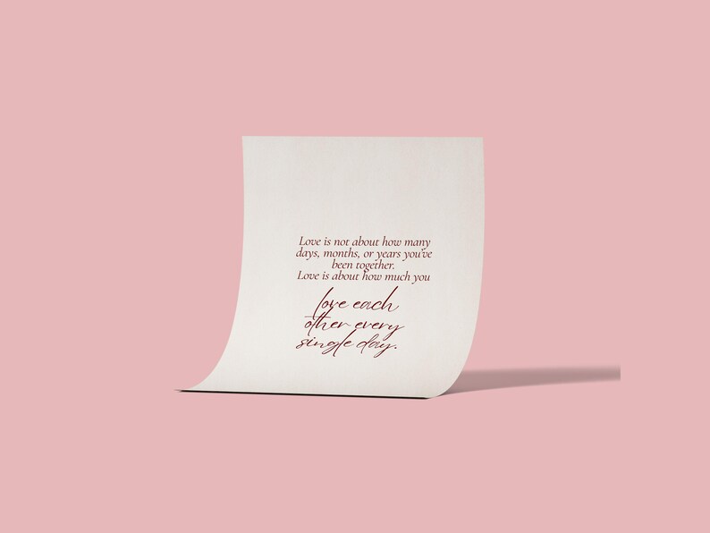 May include: A cream-colored card with the text "Love is not about how many days, months, or years you've been together. Love is about how much you love each other every single day." on a pink background.