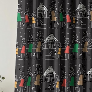 May include: Black curtain featuring a repeating pattern of white line drawings of figures, huts, and trees. The figures have red, green, and yellow accents. The curtain is suspended from a gold-coloured rod.