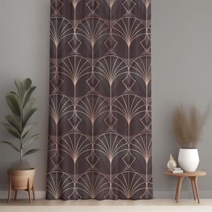 May include: A brown curtain with a repeating Art Deco fan pattern in rose gold. The design features geometric shapes and lines, creating a stylish and elegant look. The curtain is hanging in front of a grey wall.