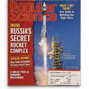 May include: The cover of Popular Science magazine, August 2000 issue, features a rocket launching into a blue sky. The magazine's title is in large red letters. The cover also includes text about Russia's secret rocket complex and a special report.