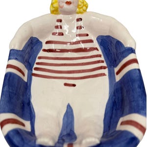 May include: A handmade wooden sign with the text "Welcome to our home" in a handwritten style. The sign is painted white with black lettering and a distressed finish, suitable for indoor or outdoor use.