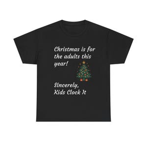 May include: Black t-shirt with the text "Christmas is for the adults this year!" and "Sincerely, Kids Clock It." A decorated Christmas tree graphic is also featured on the shirt.